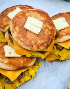 some pancakes with cheese and other toppings on them