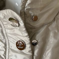 Authentic Chanel, The Best Ever Made By Chanel 5 In 1 Versatile Jacket Coat. Wear It 5 Different Ways Reversible. (1) Blue Black Silver On Top. (2) Metallic Goldish/Silver On Top. Zip Out To 2 Pieces.(3)Where Each Piece Alone.(4)Where Only The Metallic Alone With Cc All Over Snaps Big & Small. & Big Appliqu Stitch Cc In Back, Or.(5) Hide Cc When You Want To Be Low-Key Lol. The Black/Blue Is Brand New Never Worn. The Metallic Gold/Silver Worn Only A Couple Of Times It Does Very Well In Delicate M Designer Winter Outerwear With Covered Buttons, Luxury Spring Outerwear With Button Closure, Luxury Fall Outerwear With Covered Buttons, Designer Spring Outerwear With Covered Buttons, Chanel 5, Chanel Coat, Versatile Jacket, Chanel No 5, Chanel Jacket