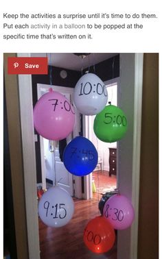 balloons are hanging from the ceiling in front of an open door with numbers on them