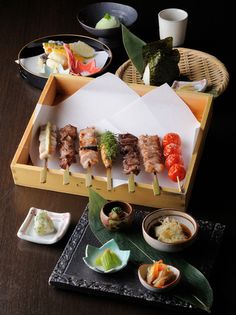 an assortment of sushi is displayed on a tray