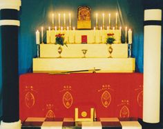 the altar is decorated with candles and decorations