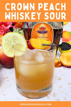 a close up of a drink in a glass on a table with fruit around it