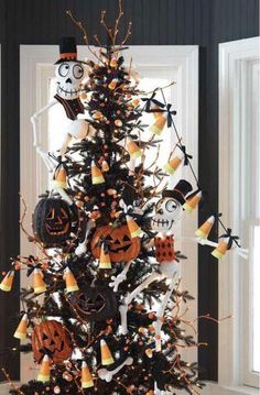 a decorated halloween tree with pumpkins and jack - o'- lanterns