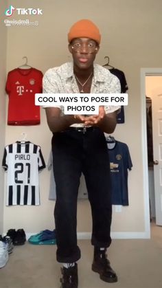 a man standing in front of a wall with clothes hanging on it and the words cool ways to pose for photos