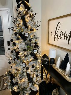 a decorated christmas tree with black and white ornaments