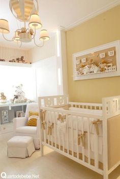 a baby's room is decorated in yellow and white