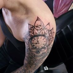 a woman with a clock tattoo on her arm