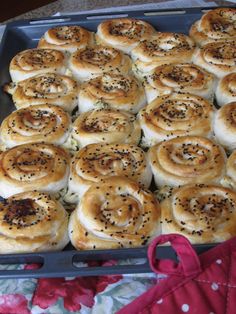 a pan filled with rolls on top of a table