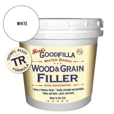 a bucket of wood and grain filler next to a label for goodfella