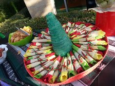 an apple tree made out of sticks and apples in the shape of a christmas tree