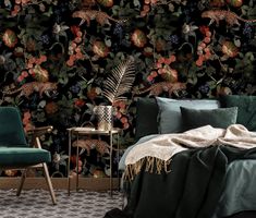 a bedroom with a leopard wallpaper and green velvet chair in front of the bed