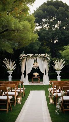 an outdoor ceremony setup with white flowers and greenery