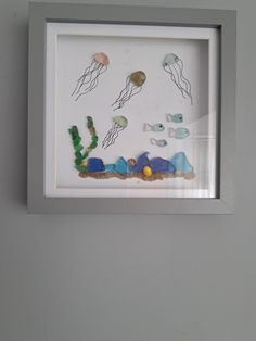 a white frame with some sea animals in it