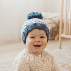 Knit in soft, chunky yarn, this hat has an intricate pattern in Slate Surf, Pebble and Winter White yarn and topped with a pom pom. Each hat is partially knit from recycled, sustainable Polyester yarn made from plastic bottles. Huggalugs is on a mission to help reduce the world's plastic pollution problem Details: 100% Acrylic Cold handwash Handknit in China Size Chart: Small (0-6 months): 17" maximum head circumference Medium (6-24 months): 19" maximum head circumference Large (2-6 years): 21" Toddler Boy Tops, Baby Boy Tops, Plastic Pollution, Teething Toys, Polyester Yarn, Chunky Yarn, Baby Sweaters, Winter White