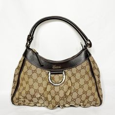 Gucci Abbey Shoulder Bag Gg Canvas Color: Tan/Brown Leather/Gold Hardware Condition: Great Bottom Of Bag Has One Mark Shown In Picture 6 Last Four Pictures Are All Four Bottom Corners Measurements: 12” Long 9” Tall 8” Drop Bags Gucci, Gucci Bags, Tan Brown, Gucci Bag, Gold Hardware, Brown Leather, Bag Lady, Gucci, Shoulder Bag