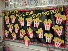 a bulletin board with popcorns on it and words that read, make our writing pop