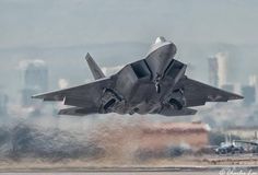 a fighter jet taking off from an airport runway