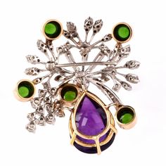 "This aesthetically alluring Retro vintage brooch pin is crafted in a solid 14K white and yellow gold, the latter applied to colored gemstones settings. It weighs 22.5 grams and measures 2 long x 1.9\" wide. This eye-catching Retro brooch is centered by one round diamond 0.78ct, complemented by some 55 round-faceted diamonds of varying sizes, 5 baguette diamonds and two marquise diamonds all approx. 3.10 cts H-I color, VS clarity approx. A prominent pear-shape amethyst cabochon 18.50 cts and 5 r Fine Jewelry Diamond Multi-stone Brooch, Fine Jewelry Diamond Multi-stone Brooches, Diamond Multi-stone Brooches In Fine Jewelry Style, Multi-stone Diamond Brooches, Fine Jewelry Multi-stone Yellow Gold Brooches, Fine Jewelry Yellow Gold Multi-stone Brooches, Formal Multi-stone Brooch In Fine Jewelry Style, Antique Multi-stone Brooches For Formal Occasions, Formal Multi-stone Brooch Fine Jewelry