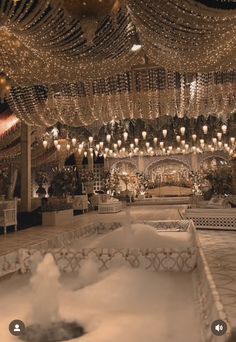 a room filled with lots of lights and chandeliers