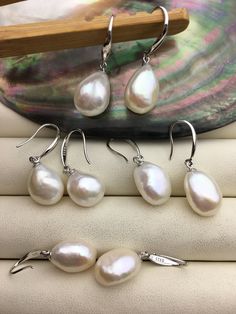 "This pearl is genuine freshwater pearl, 100% real pearl quantity: 1 pair pearl luster: high+ metal: sterling silver pearl shape: 11mm nugget pearl,it's big pearl color: white pearl grade: AAA Back to Other Jewelry Section 01: \"Tahitian,Akoya,Sea Pearl\" Section: https://www.etsy.com/shop/WenPearls?section_id=15806339 02: \"Potato/Near Round Pearl\" Section: https://www.etsy.com/shop/WenPearls?section_id=16378067 03: \"Round Pearl\" Section: https://www.etsy.com/shop/WenPearls?section_id=161632 Pearl Drop Earrings For Anniversary And Mother's Day, Silver Dangle Pearl Earrings With High Luster, Silver Pear-shaped Hypoallergenic Pearl Earrings, Silver Drop Pearl Pendant Earrings, Silver Pearl Pendant Earrings, Silver Pearl Earrings For Mother's Day, High Luster Silver Dangle Jewelry, Formal Silver Baroque Pearl Earrings, Pearl White Drop Pearl Earrings In Sterling Silver