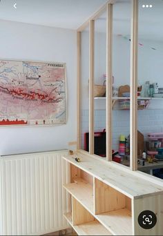 a room that has some shelves in it and a map on the wall behind it