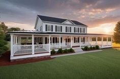 a large white house sitting on top of a lush green field