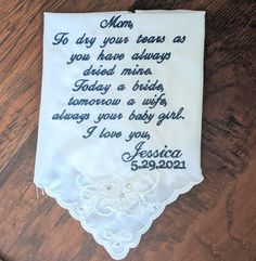 This wedding handkerchief is a wonderful gift from the bride to her mom. It is a thoughtful keepsake that will remind her of your wedding day for years to come. This handkerchief was purchased from a chain craft store prior to embroidery the poem on it. Poem can have minor changes with your name and date. *NOTE** original verse had daughter and bride asked for baby girl. When ordering let me know the followingPoem -if any changes(daughter/baby girl)Thread colorYour nameWedding date Personalized Handkerchiefs For Bridal Shower, Mother Of Groom Handkerchief, Wedding Hankerchief For Bride Embroidery, Customizable Handkerchiefs For Wedding And Mother's Day, Wedding Gift Handkerchiefs With Embroidered Text For Mother's Day, Personalized Handkerchiefs For Bridesmaids, Mother's Day Gift, White Embroidered Text Handkerchief Wedding Gift, Wedding Hankies, Wedding Handkerchief