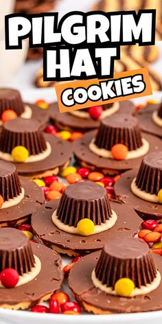 there is a platter full of cookies with chocolate frosting and candy candies