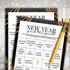 two new year's eve party games next to champagne glasses