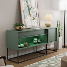 a green shelf with two vases on it next to a lamp and a painting