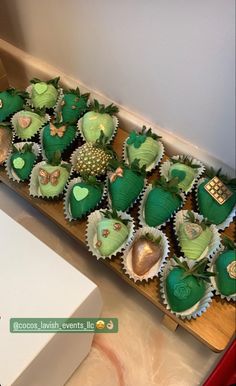 green cupcakes are arranged in the shape of hearts