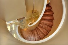 an aerial view of a spiral staircase in a house