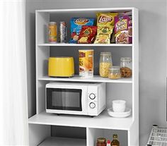 a white microwave sitting on top of a shelf