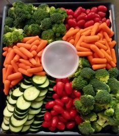 a tray filled with lots of different types of vegetables