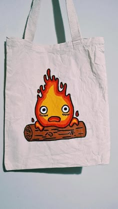 Calcifer Painting, Studio Ghibli Tote Bag, Ecobag Design Ideas, Tote Bag Design Diy Paint, Tote Bag Art Design, Toot Bags, Tote Bags Painting, Totebag Painting, Howl's Moving Castle Calcifer