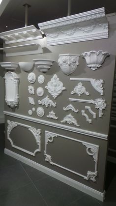 the wall is decorated with white plaster molds