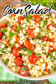 corn salad with tomatoes and basil in a white bowl