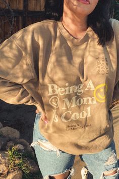 BEING A MOM IS COOL :) Get comfy in this classic Tan crewneck sweatshirt. Super soft and comfy. Perfect for summer nights. Size + Fit- Piper is 5"7 and wearing a sz 2XL for that oversized fit Trendy Mom Outfits Fall, Edgy Mom Outfits, Cool Mom Aesthetic, Edgy Mom Style, Outfits Fall 2022, Mom Aesthetic Outfit, Young Mom Outfits, Tan Crewneck, Mom Outfits Fall