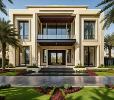 a large white house with lots of windows and palm trees in the front lawn area