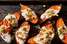 baked sweet potatoes topped with sour cream and chopped nuts