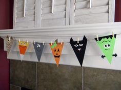 halloween buntings are hanging from the mantle