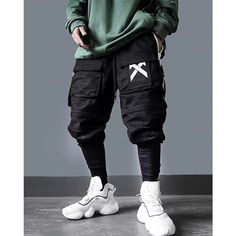 * Cargo pants "Tatsuno" is in Asian size: Take one size bigger than your usual size. The model is 1m75 for 68kg and wears the pants in size L. The Tatsuno Pants - A Cargo Techwear out of the ordinary You like techwear? We have the cargo pants for you! Combining design, style and efficiency, these cargo pants are a great piece to add to your techwear collection. More than just a pair of pants, the bottom part detaches to become cargo shorts for those hot summer days. The pockets zipper up to keep Hip Hop Cargo Pants, Harem Pants Hip Hop, Long Overalls, Techwear Pants, Mens Overalls, Japanese Streetwear, Shorts Cargo, Camo Pants, Hip Hop Streetwear