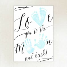 a card with the words love you to the moon and back written in black ink