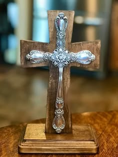 a wooden cross on top of a table