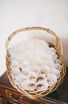 a wicker basket filled with white doily