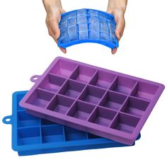 a person holding an ice cube tray with the lid open and another hand reaching for it