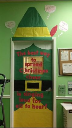 a classroom door decorated with an elf's hat and the words i'm best way to spread christmas cheer