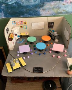 a model of a room with various objects on the table