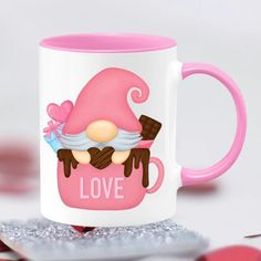 a pink and white coffee mug with an image of a gnome on it's face