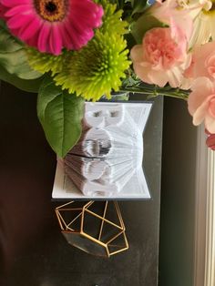 a vase filled with flowers on top of a table